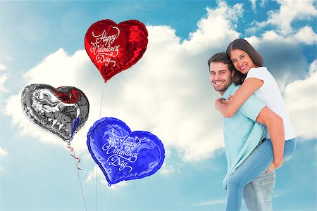 simsearch:400-07936959,k - Happy casual man giving pretty girlfriend piggy back against cloudy sky Foto de stock - Royalty-Free Super Valor e Assinatura, Número: 400-07936949