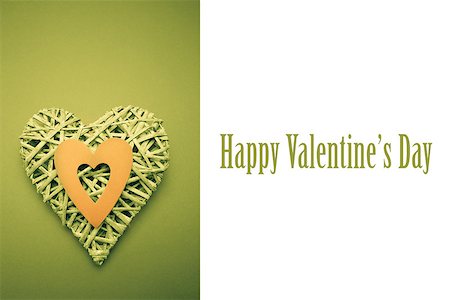 simsearch:400-06873734,k - Wicker heart ornament with green paper cut out against cute valentines message Stock Photo - Budget Royalty-Free & Subscription, Code: 400-07937097