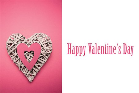 simsearch:400-06873734,k - Wicker heart ornament with pink paper cut out against cute valentines message Stock Photo - Budget Royalty-Free & Subscription, Code: 400-07937098