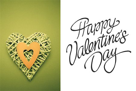 simsearch:400-06873734,k - Wicker heart ornament with green paper cut out against happy valentines day Stock Photo - Budget Royalty-Free & Subscription, Code: 400-07937114