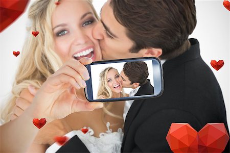 simsearch:400-07664797,k - Composite image of valentines couple taking a selfie Stock Photo - Budget Royalty-Free & Subscription, Code: 400-07937292