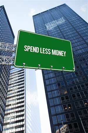 simsearch:400-07525974,k - The word spend less money and green billboard sign against low angle view of skyscrapers Stock Photo - Budget Royalty-Free & Subscription, Code: 400-07937359