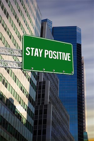 simsearch:400-07525974,k - The word stay positive and green billboard sign against low angle view of skyscrapers Stock Photo - Budget Royalty-Free & Subscription, Code: 400-07937364