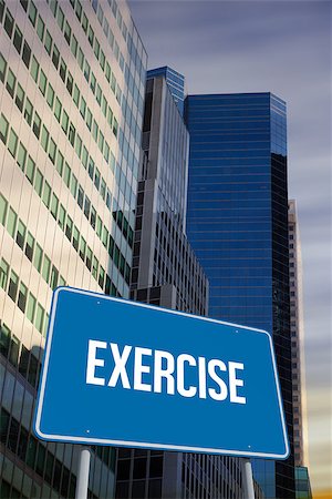 simsearch:400-07525974,k - The word exercise and blue billboard against low angle view of skyscrapers Stock Photo - Budget Royalty-Free & Subscription, Code: 400-07937378
