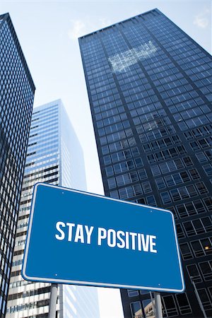 simsearch:400-07525974,k - The word stay positive and blue billboard against low angle view of skyscrapers Stock Photo - Budget Royalty-Free & Subscription, Code: 400-07937390