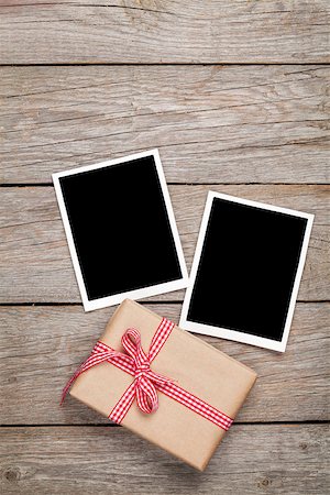 simsearch:400-07922855,k - Photo frame cards and gift box with ribbon over wooden table background Fotografie stock - Microstock e Abbonamento, Codice: 400-07937769