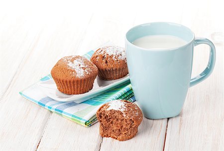 Cup of milk and cookies on white wooden table Stock Photo - Budget Royalty-Free & Subscription, Code: 400-07937787
