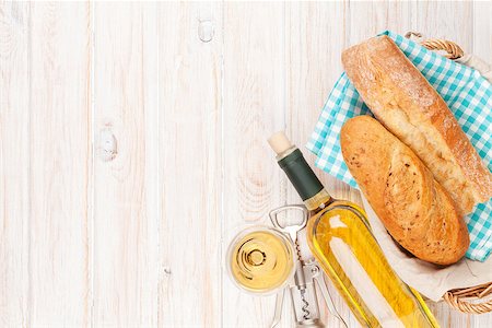 White wine and bread on white wooden table background with copy space Stock Photo - Budget Royalty-Free & Subscription, Code: 400-07937801