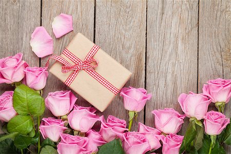 simsearch:400-08110734,k - Valentines day background with pink roses over wooden table and gift box. Top view with copy space Stock Photo - Budget Royalty-Free & Subscription, Code: 400-07937816