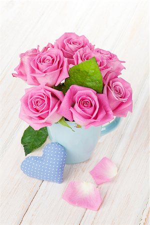 Valentines day pink roses bouquet and handmaded toy heart on white wooden table Stock Photo - Budget Royalty-Free & Subscription, Code: 400-07937819
