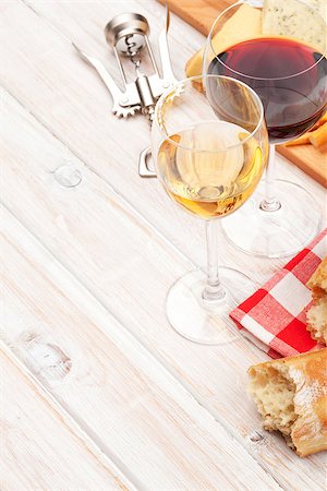 simsearch:400-08074810,k - White and red wine glasses, cheese and bread on white wooden table background with copy space Photographie de stock - Aubaine LD & Abonnement, Code: 400-07937811