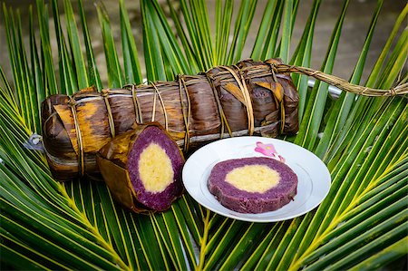 Mekong delta, Vietnam Oct 19th 2014: Banh Tet - cylindrical glutinous with violet and durian flavor Stockbilder - Microstock & Abonnement, Bildnummer: 400-07938193