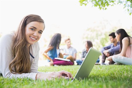simsearch:400-07939821,k - Happy student using her laptop outside at the university Photographie de stock - Aubaine LD & Abonnement, Code: 400-07938359