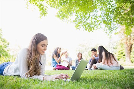 simsearch:400-07939821,k - Happy student using her laptop outside at the university Photographie de stock - Aubaine LD & Abonnement, Code: 400-07938360