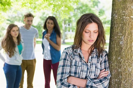 Lonely student being bullied by her peers at the university Stock Photo - Budget Royalty-Free & Subscription, Code: 400-07938381