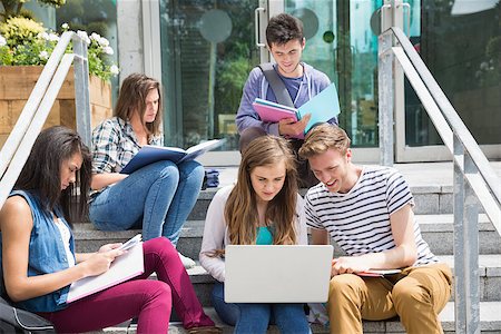 simsearch:400-07939821,k - Students sitting on steps studying at the university Photographie de stock - Aubaine LD & Abonnement, Code: 400-07938398