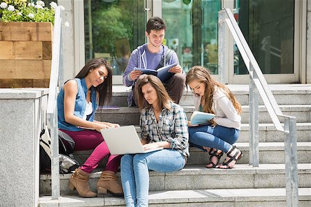 simsearch:400-07939821,k - Students sitting on steps studying at the university Photographie de stock - Aubaine LD & Abonnement, Code: 400-07938393