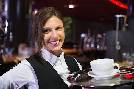 Happy barmaid holding tray with coffee in a bar Stock Photo - Budget Royalty-Free & Subscription, Code: 400-07938425