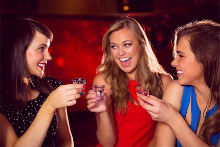 simsearch:400-04040205,k - Pretty friends drinking shots together at the nightclub Stock Photo - Budget Royalty-Free & Subscription, Code: 400-07938496