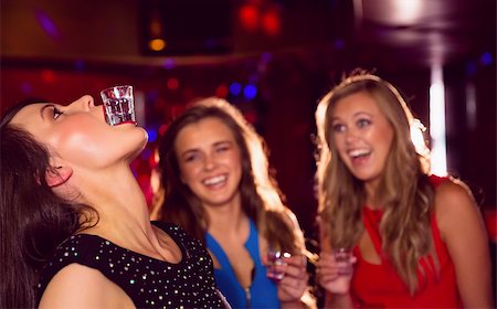 simsearch:400-04040205,k - Pretty friends drinking shots together at the nightclub Stock Photo - Budget Royalty-Free & Subscription, Code: 400-07938497