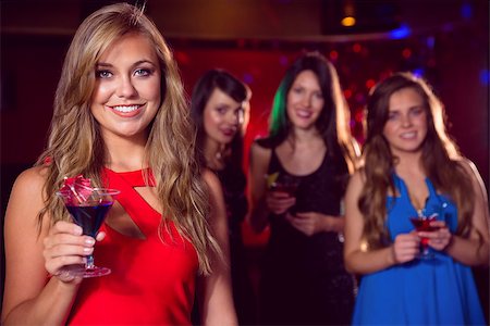 simsearch:649-06844392,k - Pretty blonde drinking a cocktail at the nightclub Stock Photo - Budget Royalty-Free & Subscription, Code: 400-07938510