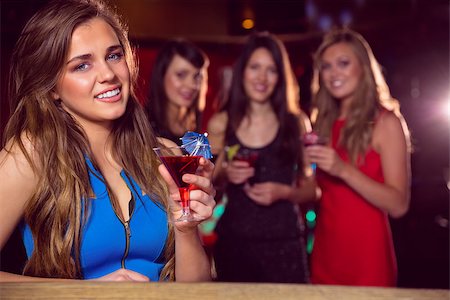 simsearch:400-07939979,k - Pretty blonde drinking a cocktail at the nightclub Fotografie stock - Microstock e Abbonamento, Codice: 400-07938511