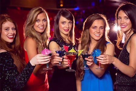 simsearch:400-07939979,k - Pretty friends drinking cocktails together at the nightclub Fotografie stock - Microstock e Abbonamento, Codice: 400-07938523
