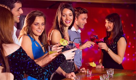 simsearch:400-07939979,k - Happy friends on a night out together at the nightclub Fotografie stock - Microstock e Abbonamento, Codice: 400-07938554