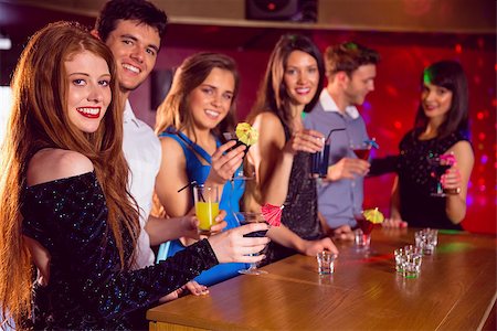 simsearch:400-07939979,k - Happy friends on a night out together at the nightclub Fotografie stock - Microstock e Abbonamento, Codice: 400-07938555