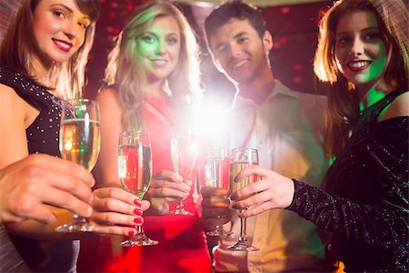 simsearch:400-07939979,k - Happy friends on a night out together at the nightclub Fotografie stock - Microstock e Abbonamento, Codice: 400-07938580