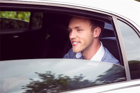 Young man talking on phone in limousine on a sunny day Stock Photo - Budget Royalty-Free & Subscription, Code: 400-07938640
