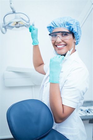 simsearch:400-07941465,k - Portrait of female dentist wearing surgical cap and safety glasses Stock Photo - Budget Royalty-Free & Subscription, Code: 400-07938817