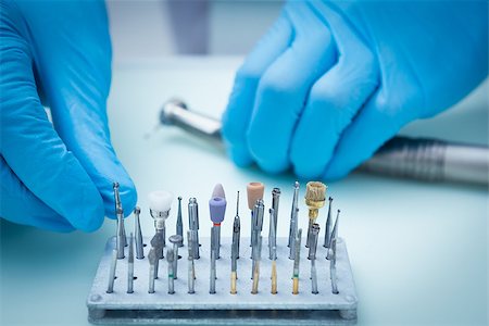 Close up of gloved hands picking dental tools Stock Photo - Budget Royalty-Free & Subscription, Code: 400-07938844