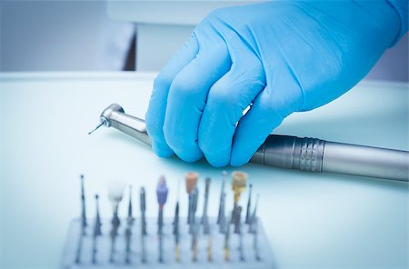 Close up of gloved hand picking dental tools Stock Photo - Budget Royalty-Free & Subscription, Code: 400-07938843