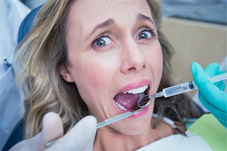 simsearch:400-07938964,k - Close up of woman having her teeth examined by dentist and assistant Stockbilder - Microstock & Abonnement, Bildnummer: 400-07939054
