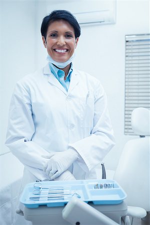 dentistry tray - Portrait of smiling young female dentist Stock Photo - Budget Royalty-Free & Subscription, Code: 400-07939124