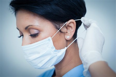 simsearch:400-07941465,k - Close up of female dentist wearing surgical mask Stock Photo - Budget Royalty-Free & Subscription, Code: 400-07939158