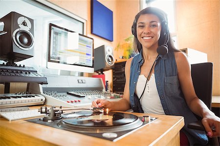 Portrait of an university student with a turn table in the studio of a radio Stock Photo - Budget Royalty-Free & Subscription, Code: 400-07939615