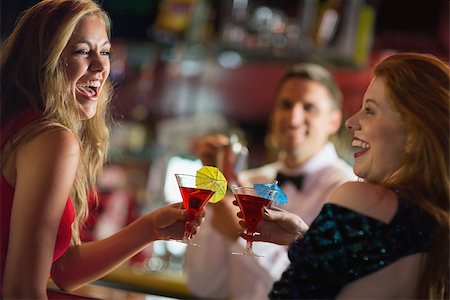simsearch:693-06021224,k - Pretty girls toasting with cocktails in a bar Stock Photo - Budget Royalty-Free & Subscription, Code: 400-07939887
