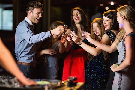 drinking shots - Happy friends drinking shots by the dj booth at the nightclub Stock Photo - Budget Royalty-Free & Subscription, Code: 400-07939978