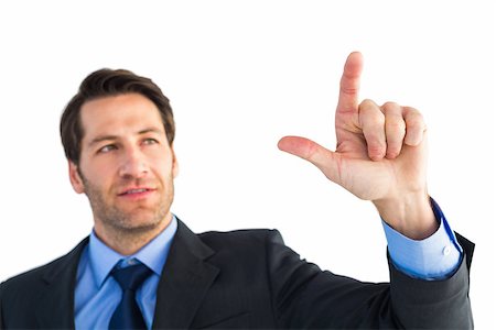 simsearch:400-04861869,k - Confident businessman pointing at something on white background Foto de stock - Royalty-Free Super Valor e Assinatura, Número: 400-07930001