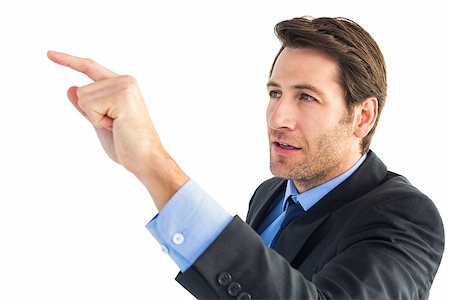 simsearch:400-06795988,k - Serious businessman pointing at something on white background Foto de stock - Super Valor sin royalties y Suscripción, Código: 400-07930002