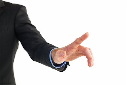 simsearch:400-04861869,k - Businessman hand pointing something on white background Foto de stock - Royalty-Free Super Valor e Assinatura, Número: 400-07930011