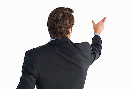 simsearch:400-04861869,k - Rear view of young businessman in suit pointing on white background Foto de stock - Royalty-Free Super Valor e Assinatura, Número: 400-07930012