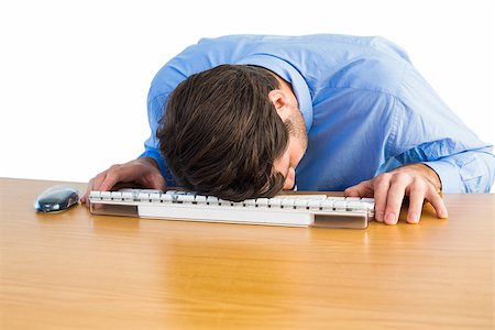 simsearch:693-03644020,k - Businessman sleeping on his keyboard on white background Photographie de stock - Aubaine LD & Abonnement, Code: 400-07930052