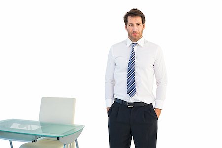 Businessman standing with hands in pockets on white background Stock Photo - Budget Royalty-Free & Subscription, Code: 400-07930062