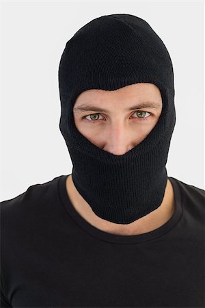 simsearch:400-06881880,k - Portrait of burglar wearing a balaclava on white background Stockbilder - Microstock & Abonnement, Bildnummer: 400-07930087