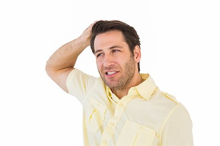 Thinking man posing with hand behind head on white background Stock Photo - Budget Royalty-Free & Subscription, Code: 400-07930123