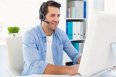 simsearch:400-07466593,k - Photo editor talking with headphone in office Stock Photo - Budget Royalty-Free & Subscription, Code: 400-07930226