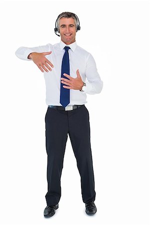 Businessman wearing headphone and doing gesture on white background Stock Photo - Budget Royalty-Free & Subscription, Code: 400-07930436